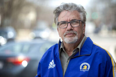 Boston Marathon medical coordinator Chris Troyanos looks along the route in Wellesley. (Robin Lubbock/WBUR)