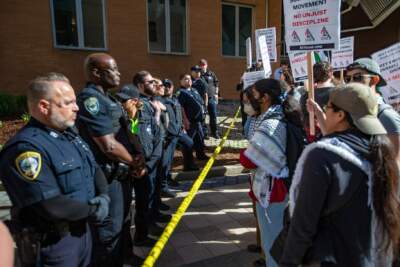 Police form a line after they moved MIT student protesters away from the front of the Stata Center during a rally on May 9. (Jesse Costa/WBUR)