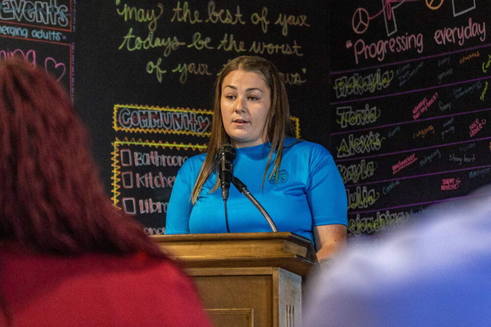 P.E.A.C.E. program participant Makayla Lowe speaks to guests at the opening event for the MCI-Framingham program for women. (Jesse Costa/WBUR)