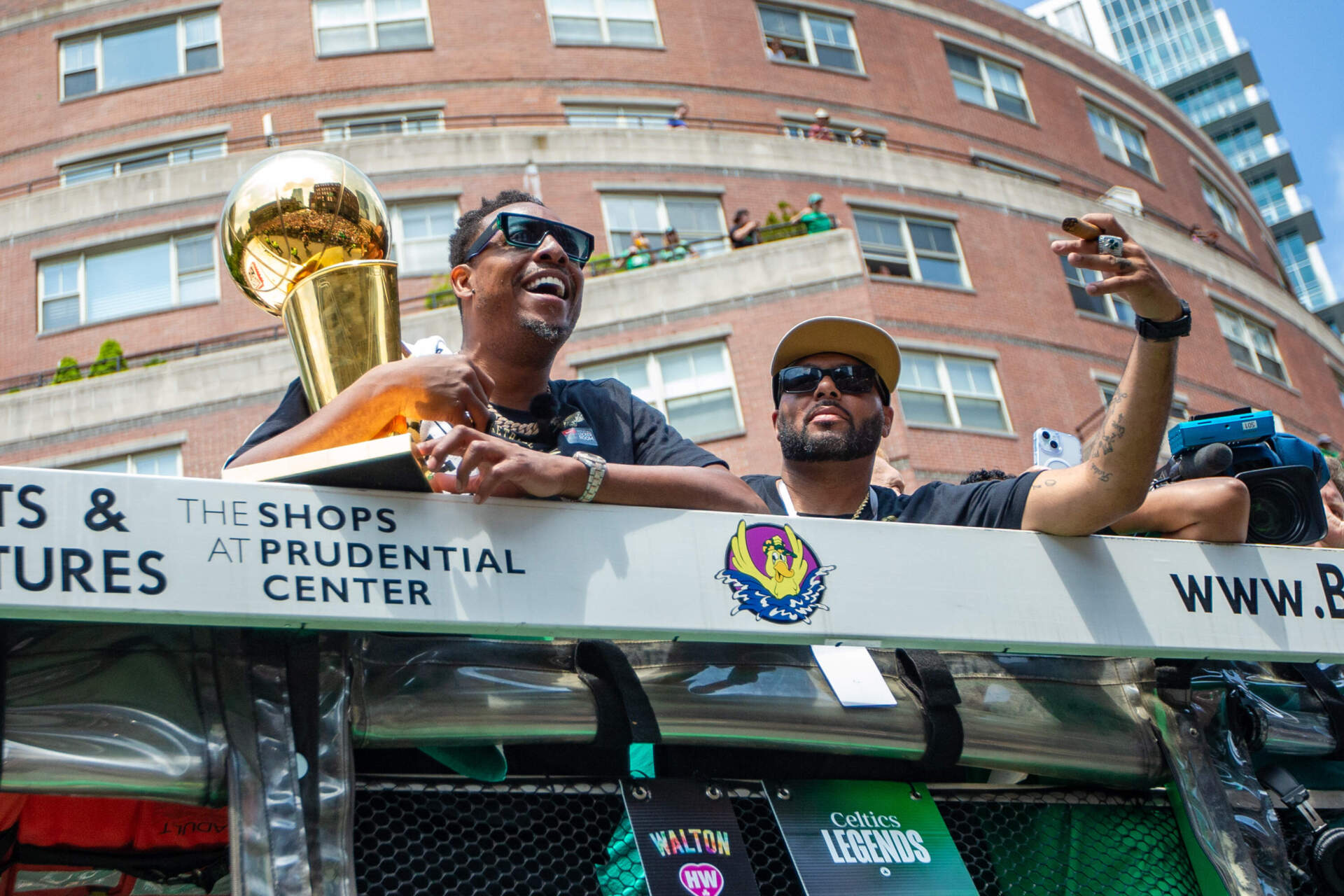 2008 champions Paul Pierce and Eddie House celebrate with the 2024 championship team. (Jesse Costa/WBUR)