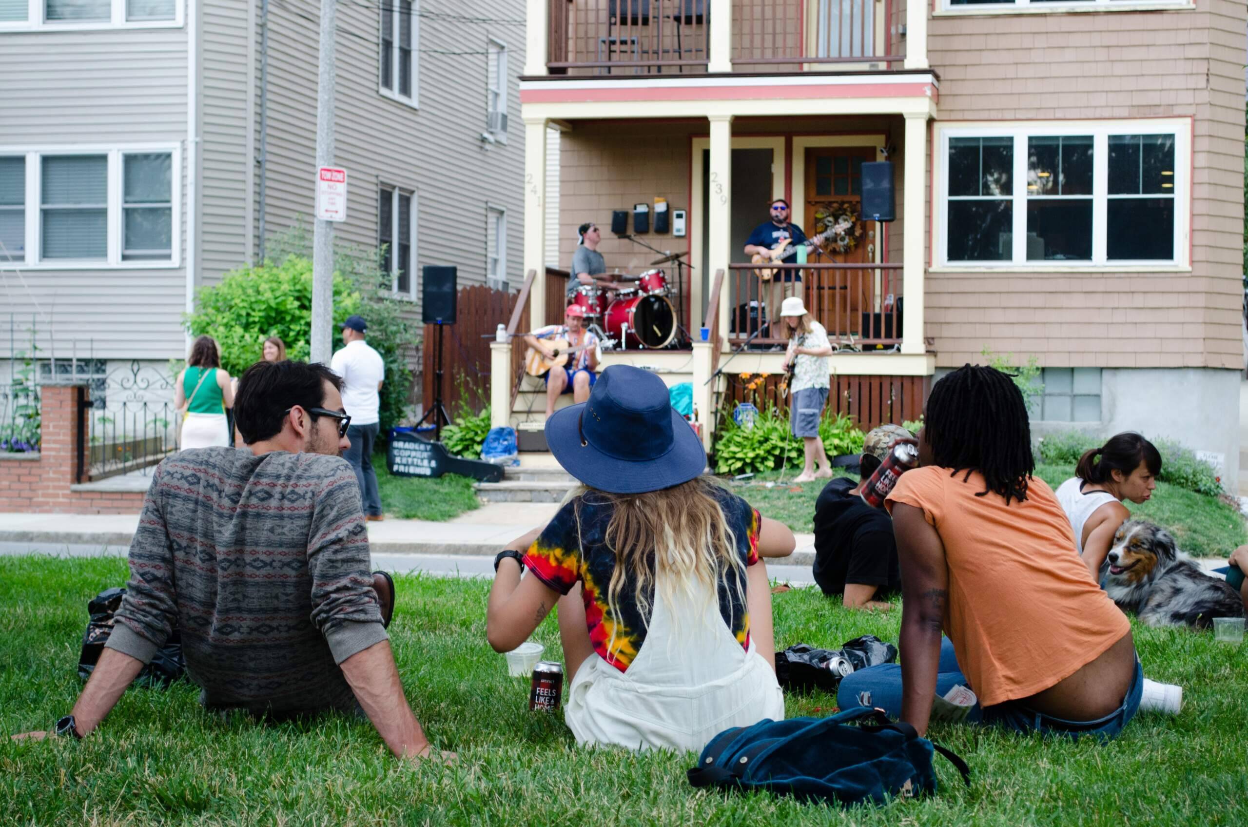 Spectators on Lamartine Street at the 2017 Jamaica Plain Porchfest. (Elizabeth Gillis/WBUR)