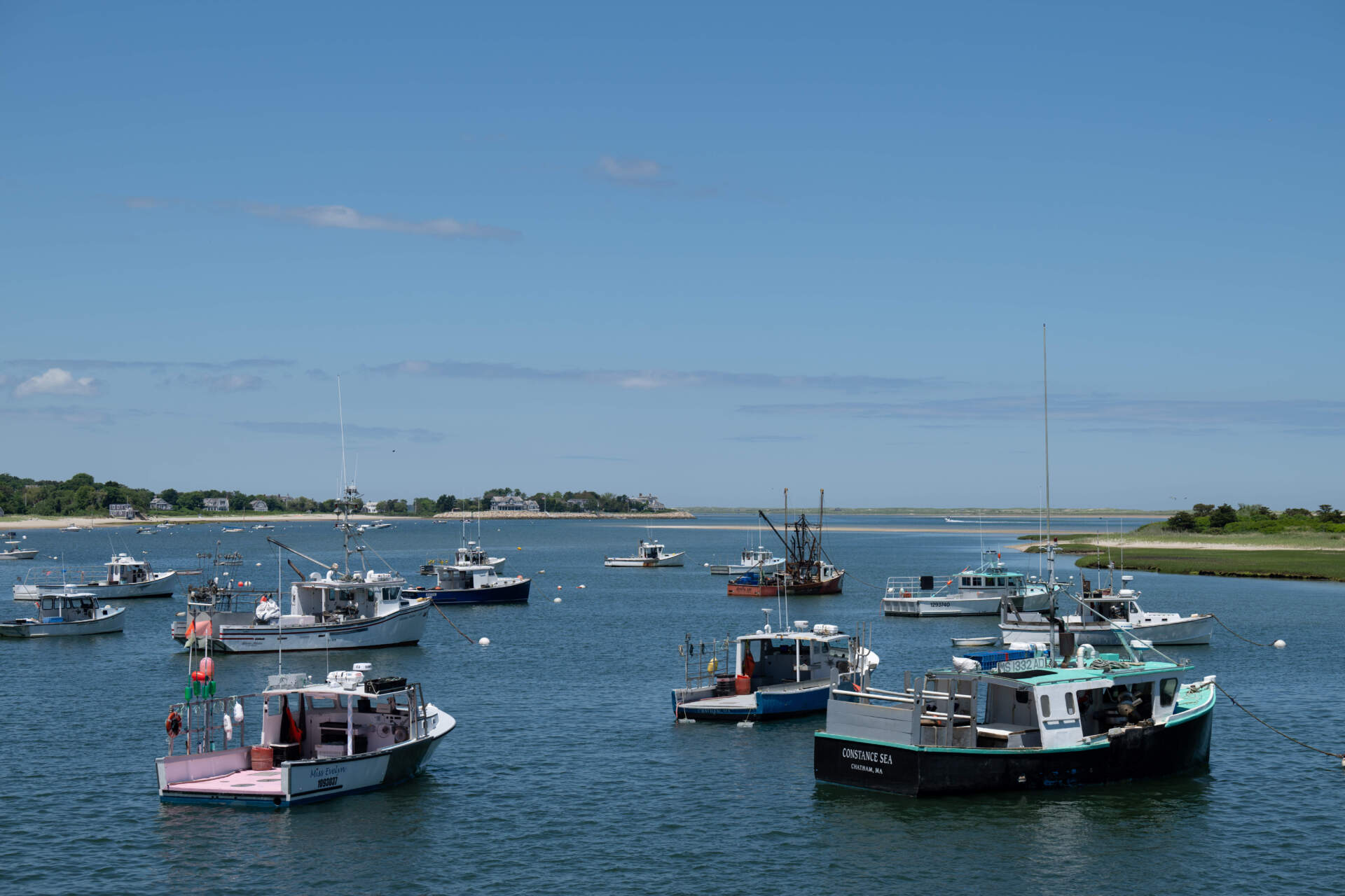 Boats are docked near in Chatham, Mass. (Raquel C. Zaldívar/New England News Collaborative)