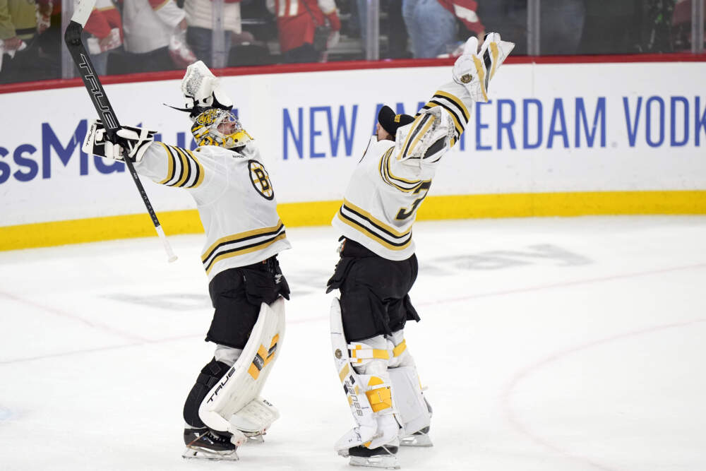 Boston Bruins goaltenders Jeremy Swayman, left, and Linus Ullmark celebrate after the Bruins beat the Florida Panthers 2-1 during Game 5 of the second-round series of the Stanley Cup Playoffs. (Wilfredo Lee/AP)