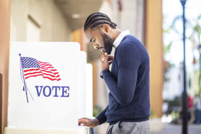 A millennial votes in an election. (Adam Kaz/Getty Images)