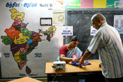 TOPSHOT - A man (R) has his finger marked with ink after casting his vote at a polling station as voting starts during the first phase of India's general election in Chennai, capital of India's Tamil Nadu state on April 19, 2024. (Photo by R. Satish BABU / AFP) (Photo by R. SATISH BABU/AFP via Getty Images)