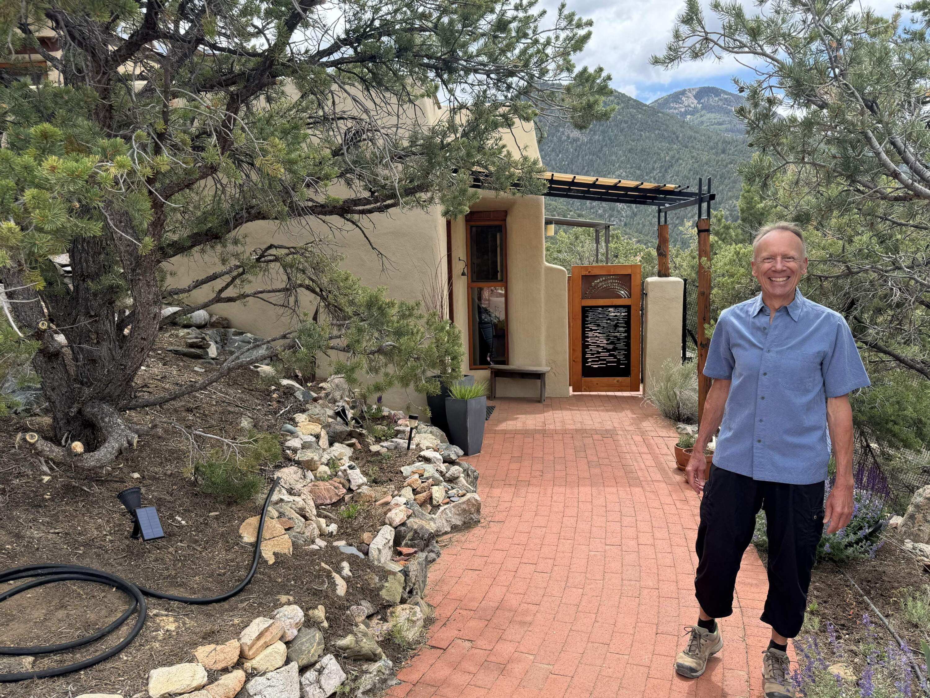 The front gate to architect Karlis Viceps’ home in the mountains outside Taos, New Mexico. (Chris Bentley/Here &amp; Now)