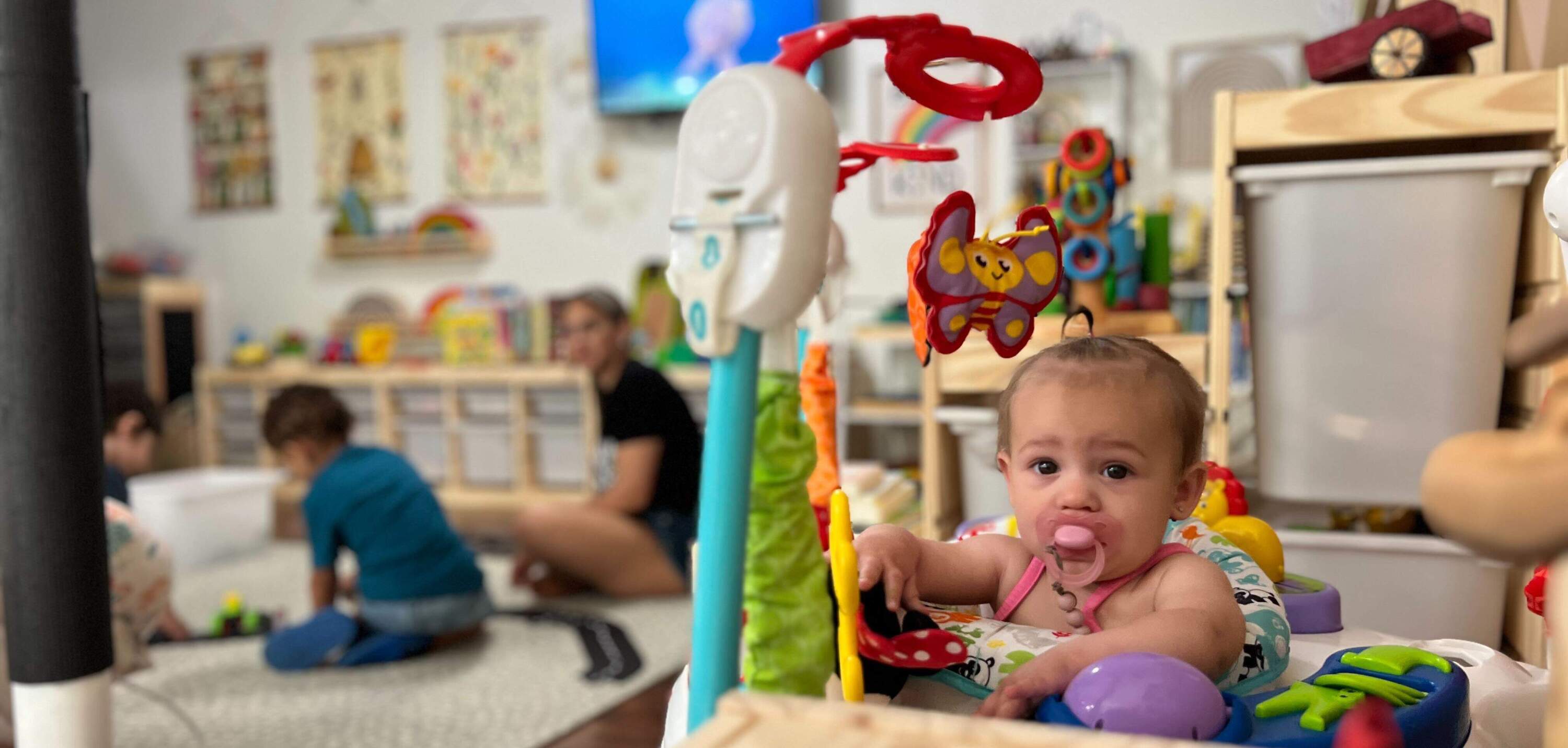 Jessica Paselli's child care business is a colorful space with bright windows. On warm days, kids spend most of their time outside. (Ashley Locke/Here & Now)