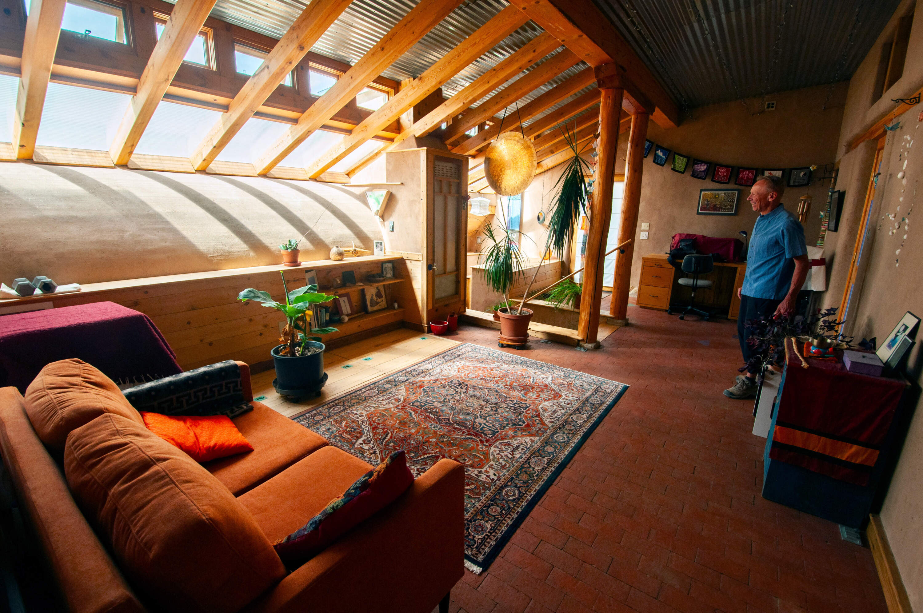 Architect Karlis Viceps at his home in the mountains outside Taos, New Mexico. (Chris Bentley/Here &amp; Now)