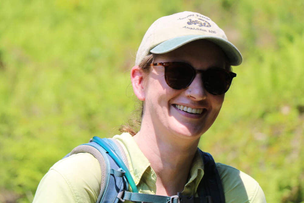 Fish and Wildlife Department technician Molly Parren near the site in southern Vermont where the black racer snake was found. (Howard Weiss-Tisman/Vermont Public)