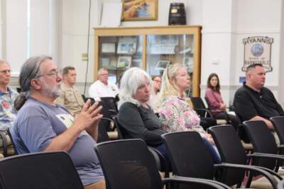 Hyannis residents Jane Walsh and Betsy Young (center) listen closely to the presentation about how PFAS chemicals could affect their health. (Eve Zuckoff/CAI)