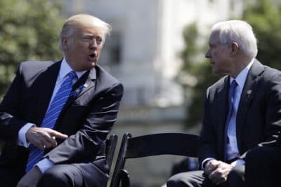 President Donald Trump talks with Attorney General Jeff Sessions, gestures before speaking at the 36th Annual National Peace Officers' memorial service, Monday, May 15. 2017, on Capitol Hill in Washington. (Evan Vucci/AP)