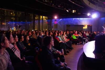 Guests enjoy a live podcast taping at CitySpace. (GT Nguyen / WBUR)